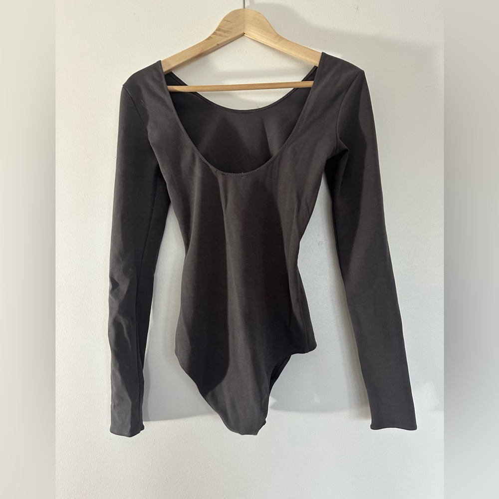 Wilfred Arita is brand long sleeve bodysuit in grey purple